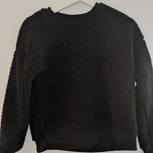 black puffy sweater